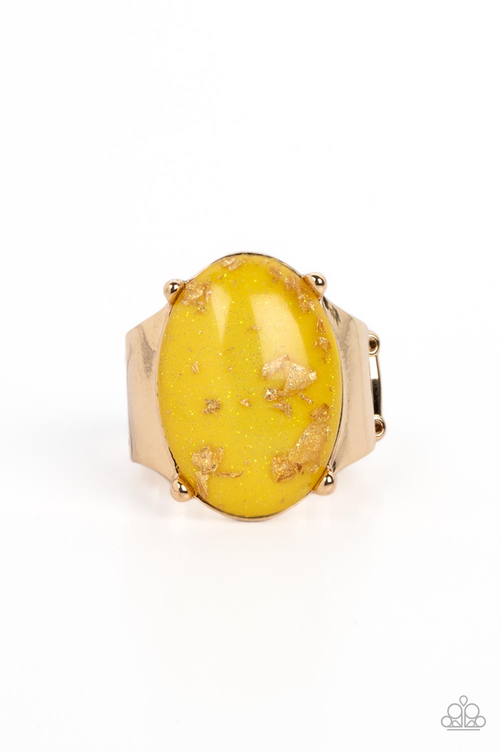 Encased in a sleek gold frame, an oversized glassy yellow bead with an opalescent finish, is speckled in flecks of gold shimmer for a bubbly, yet glitzy effect. Thick, sleek, gold curves from the glassy bead, anchoring the oversized shimmer to the design. Features a stretchy band for a flexible fit.