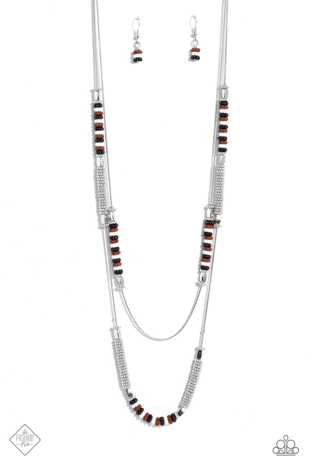 Featuring a layered display, two elongated silver snake chains dance down the neckline. Sections of shiny silver flower beads, capped by high sheen silver accents, are interspersed with stacks of white, Caramel Café, black, and silver studded beads, creating a bubbly, fanciful finish in rich neutral shades. Features an adjustable clasp closure.  Sold as one individual necklace. Includes one pair of matching earrings.
