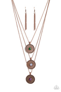 Stamped with a floral motif, oversized copper pendants trickle from three layered chains below the neckline for a casual style. Featured in the center of each disc, a jade, opal white, and amethyst stone create a pop of color against the textured backdrop. Features an adjustable clasp closure. As the stone elements in this piece are natural, some color variation is normal.