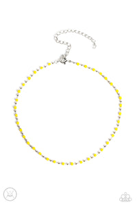 Dainty silver beads and square Samoan Sun beads delicately link around the neck, creating a minimalist inspired bright pop of color. Features an adjustable clasp closure.