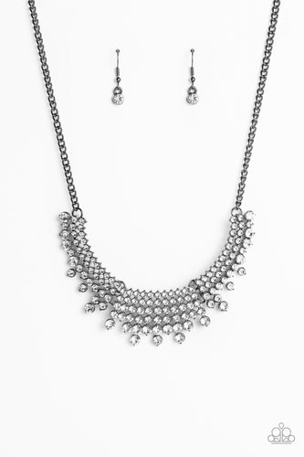 Shimmery strands of multi-sized white rhinestones majestically morph into gunmetal framed layers along the collar for a sparkling statement piece. Features an adjustable clasp closure. 