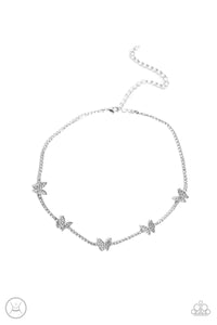 Infused along a row of dainty white rhinestones pressed into silver box-chain settings, a collection of silver butterflies coalesces around the neckline for a whimsical finish. Each butterfly features a dainty shimmer of white rhinestones on its wings, for a sparkly statement. Features an adjustable clasp closure. 