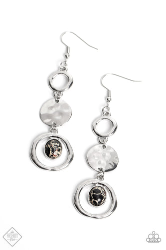 A classic silver hoop gives way to a shimmery silver disc that is hammered in rippling textures. Below the high-sheen disc, a marbled black stone, wrapped in a thin silver border, is affixed to the top of a warped silver frame, completing the cascade of artisanal accents. Earring attaches to a standard fishhook fitting. As the stone elements in this piece are natural, some color variation is normal.  Sold as one pair of earrings.