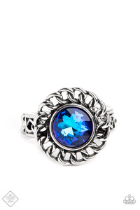 High-sheen silver chain links encircle a vibrant, faceted blue gem center, creating a gorgeous contrast of grit and glam. A band of silver chain link arcs across the finger underneath the colorful centerpiece, resulting in an edgy centerpiece that sits boldly atop the finger. Features a dainty stretchy band for a flexible fit.  Sold as one individual ring.  New Kit Fashion Fix
