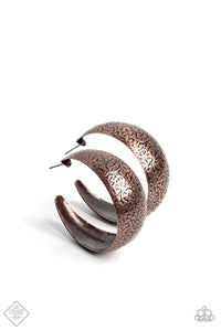 A wide copper band is adorned in intricate vintage texture, as it curls boldly into a rustic hoop. Earring attaches to a standard post fitting. Hoop measures approximately 1 1/2" in diameter.  Sold as one pair of hoop earrings.