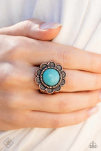 Load image into Gallery viewer, An oversized turquoise stone is pressed into the center of a blooming copper flower, radiating with antiqued details and textures for a whimsical look. Features a stretchy band for a flexible fit.  Sold as one individual ring.
