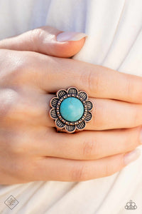 An oversized turquoise stone is pressed into the center of a blooming copper flower, radiating with antiqued details and textures for a whimsical look. Features a stretchy band for a flexible fit.  Sold as one individual ring.