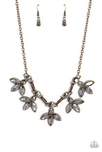 Load image into Gallery viewer, Featuring smoldering marquise style cuts, oversized smoky gems fan out from an interconnected, circular smoky rhinestone display. Separating the dauntless florals, airy brass ovals, stamped with a dot motif, create additional eye-catching sheen. Features an adjustable clasp closure.
