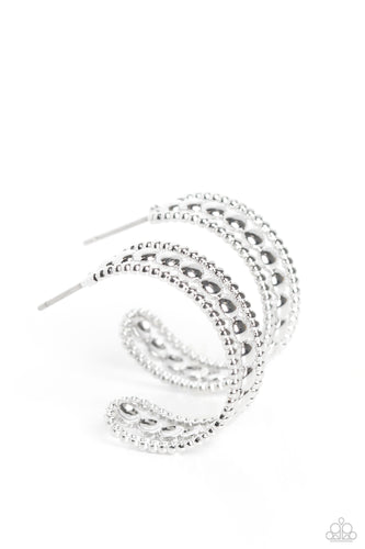 A row of high-sheen silver studs runs down the center of an airy silver hoop for an edgy look. Layering against the centermost studs, smaller silver studs grace both sides of the hoop creating additional eye-catching texture and detail. Earring attaches to a standard post fitting. Hoop measures approximately 1