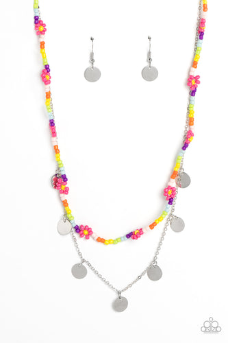 Multicolored seed beads are threaded along a wire, falling along the collar in a capricious pattern. Creating additional charm to the design, Pink Peacock seed bead flowers bloom amongst the bright pops of color. A delicate silver chain, infused with twinkling silver discs, layers with the colorful beads for a sassy, yet sweet, combo. Features an adjustable clasp closure. 