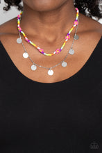 Load image into Gallery viewer, Multicolored seed beads are threaded along a wire, falling along the collar in a capricious pattern. Creating additional charm to the design, Pink Peacock seed bead flowers bloom amongst the bright pops of color. A delicate silver chain, infused with twinkling silver discs, layers with the colorful beads for a sassy, yet sweet, combo. Features an adjustable clasp closure. 
