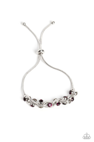 Silver oval links lined with texture interlock around one another at the end of a silver snake chain. Featured in the center of each link, a double-sided pendant with dainty amethyst rhinestones glimmers for a subtle pop of color around the wrist. Features an adjustable sliding knot closure.