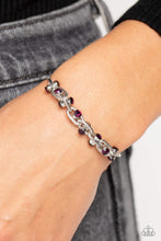 Load image into Gallery viewer, Silver oval links lined with texture interlock around one another at the end of a silver snake chain. Featured in the center of each link, a double-sided pendant with dainty amethyst rhinestones glimmers for a subtle pop of color around the wrist. Features an adjustable sliding knot closure.
