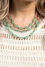 Load image into Gallery viewer, Shiny silver cubed accents, cloudy, milky, green oval beads and milky peach beads coalesce down the neckline on invisible wires, creating a trio of colorful layers. Features an adjustable clasp closure.
