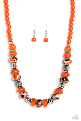 An earthy collection of dotted silver beads, rounded milky orange beads, studded silver rings, orange-spotted ceramic-like beads and textured silver beads are threaded along an invisible wire below the collar for an authentic artisan flair. Features an adjustable clasp closure. 