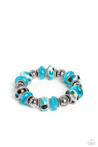 An earthy collection of dotted silver beads, rounded milky turquoise beads, studded silver rings, turquoise-spotted ceramic-like beads and textured silver beads are threaded along an invisible wire below the collar for an authentic artisan flair. Features an adjustable clasp closure.  Sold as one individual necklace. Includes one pair of matching earrings.  New Kit Get The Complete Look! Bracelet: "Warped Wayfarer - Turquoise" (Sold Separately)