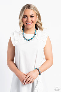 An earthy collection of dotted silver beads, rounded milky turquoise beads, studded silver rings, turquoise-spotted ceramic-like beads and textured silver beads are threaded along an invisible wire below the collar for an authentic artisan flair. Features an adjustable clasp closure.  Sold as one individual necklace. Includes one pair of matching earrings.  New Kit Get The Complete Look! Bracelet: "Warped Wayfarer - Turquoise" (Sold Separately)
