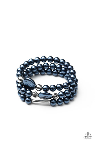 Featuring pearly blue and shiny silver finishes, a refined assortment of round, hammered, ornate, and cylindrical beads are threaded along stretchy bands around the wrist for a timelessly layered look.  Sold as one set of three bracelets.