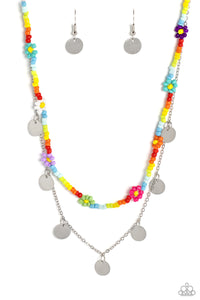 Multicolored seed beads are threaded along a wire, falling along the collar in a capricious pattern. Creating additional charm to the design, Pink Peacock, white, purple, blue, orange, green, purple, and baby pink seed bead flowers bloom amongst the bright pops of color. A delicate silver chain, infused with twinkling silver discs, layers with the colorful beads for a sassy, yet sweet, combo. Features an adjustable clasp closure.