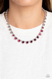 Spanning around the entirety of the neckline, a refined collection of rhinestones in shades of pink and purple are pressed into airy, studded, silver square frames, tilted on their sides for a three-dimensional shimmer. The frames and rhinestones gradually increase in size as they fall down the neckline, accentuating their colorful sparkle.