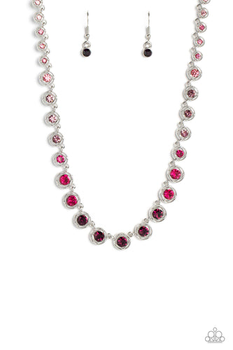 Spanning around the entirety of the neckline, a refined collection of rhinestones in shades of pink and purple are pressed into airy, studded, silver square frames, tilted on their sides for a three-dimensional shimmer. The frames and rhinestones gradually increase in size as they fall down the neckline, accentuating their colorful sparkle.