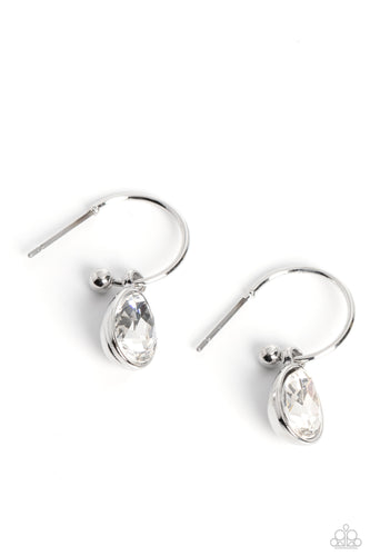 A small, skinny, shiny silver hoop curves around the ear in a timeless fashion. A shiny silver ball is affixed to the end of the hoop, reminiscent of a barbell fitting. A white, teardrop gem, encased in a shiny silver frame slides along the curvature of the hoop, adding a surprising hint of shimmery movement. Earring attaches to a standard post fitting. Hoop measures approximately 1/2