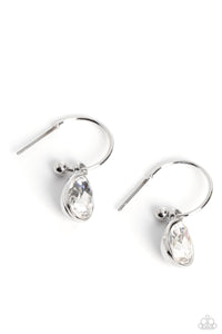 A small, skinny, shiny silver hoop curves around the ear in a timeless fashion. A shiny silver ball is affixed to the end of the hoop, reminiscent of a barbell fitting. A white, teardrop gem, encased in a shiny silver frame slides along the curvature of the hoop, adding a surprising hint of shimmery movement. Earring attaches to a standard post fitting. Hoop measures approximately 1/2" in diameter. 