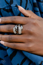 Load image into Gallery viewer, A pair of oversized, rounded chain links interlock across the top of the finger, creating an unflinching statement piece. One gunmetal link is coated in sparkling white rhinestones, while the other emits a radiant sheen from its polished surface, resulting in a flawless mashup of grit and glitz. Features a stretchy band for a flexible fit.  Sold as one individual ring
