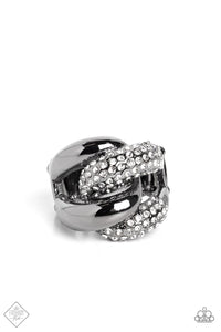 A pair of oversized, rounded chain links interlock across the top of the finger, creating an unflinching statement piece. One gunmetal link is coated in sparkling white rhinestones, while the other emits a radiant sheen from its polished surface, resulting in a flawless mashup of grit and glitz. Features a stretchy band for a flexible fit.  Sold as one individual ring