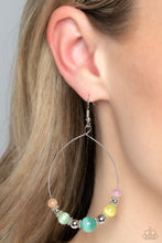 Load image into Gallery viewer, Silver beads, dainty silver wheel beads, and vibrant pink, yellow, blue, green, and orange cat&#39;s eye stones in varying sizes are threaded along a delicate teardrop-shaped silver wire resulting in an earthy lure. Earring attaches to a standard fishhook fitting. 
