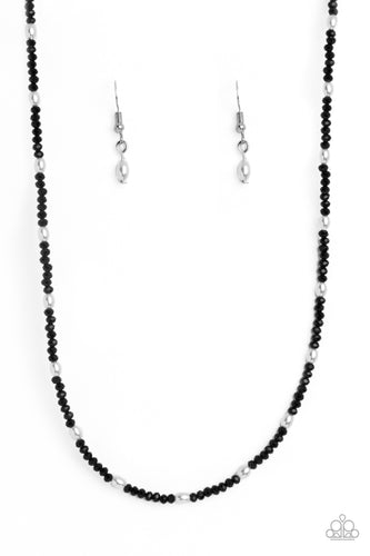 A dainty row of faceted black crystal-like seed beads delicately links around the neck, resulting in a radiant glimmer. Dainty white, oval pearls infused along the neckline create additional refinement and charm to the design. Features an adjustable clasp closure. 