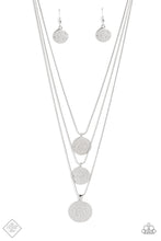 Load image into Gallery viewer, Three silver discs trickle from the bottom of three silver snake chains, creating shimmery monochromatic layers down the chest. An intricate floral design is stamped onto each disc, adding a whimsical touch to the charming design. Features an adjustable clasp closure.  Sold as one individual necklace. Includes one pair of matching earrings.
