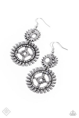 A pair of variegated gear pendants, embellished with textures and a dusting of white rhinestones, stack into an industrial cascade to create a steampunk-like lure. Earring attaches to a standard fishhook fitting.  Sold as one pair of earrings.