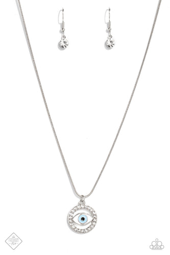 A light blue eye pendant is accented by silver edging and then wrapped in a circular border of brilliant white rhinestones. The sparkling charm slides effortlessly along a dainty snake chain, adding eye-catching movement to the design. Features an adjustable clasp closure.