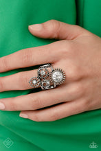 Load image into Gallery viewer, Centered atop a pair of arcing silver bands, four gear pendants with varying textures, details, sizes, and a dusting of gems climb up the finger for a steampunk-styled centerpiece. Features a stretchy band for a flexible fit.  Sold as one individual ring.
