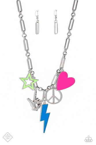 A collection of oversized 2000s-inspired charms gathers along a silver paperclip chain. A bright green star, a hand charm signing 