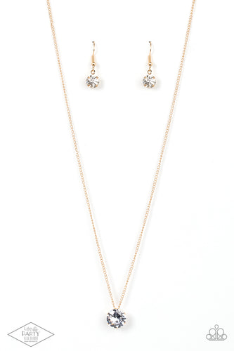 A single rhinestone sparkles brilliantly at the bottom of a dainty gold chain, creating a stunning solitaire design. Features an adjustable clasp closure. 