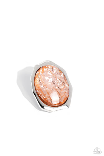 Featuring a refracted shimmer, an oversized oval-cut, glossy orange gem sparkles from an asymmetrical silver frame for an edgy statement piece atop the finger. Features a stretchy band for a flexible fit. 