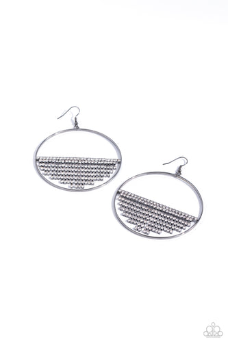 A curtain of white rhinestones is stretched between the edges of a skinny, oversized gunmetal hoop, creating a shimmering display. The rhinestones taper towards the center as they sway and cascade, adding sparkly movement for a fierce industrial finish. Earring attaches to a standard fishhook fitting. 