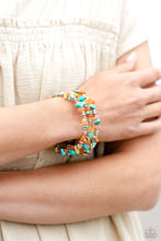 Load image into Gallery viewer, Featuring a chiseled finish, a mismatched collection of orange, turquoise, and yellow stones and shiny silver beads are threaded along a coiled wire, creating an earthy infinity wrap style bracelet. As the stone elements in this piece are natural, some color variation is normal. 
