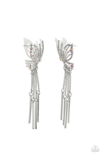 Featuring dainty white rhinestones and dainty marquise-cut iridescent gems, a thin, elongated, airy silver butterfly is titled to the side as if about to take off in flight. A collection of dainty silver rods swings from dainty silver chain tassels at the bottom of the whimsical frame for some free-falling movement. Earring attaches to a standard post fitting. Due to its prismatic palette, color may vary. 