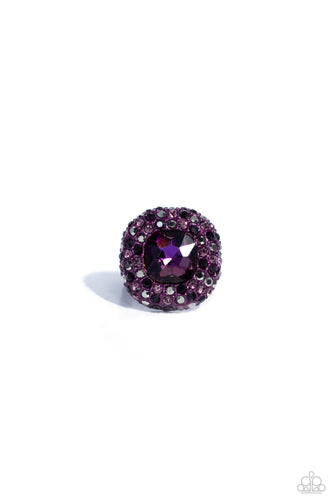 Featuring a regal square cut, an oversized plum gem nestles inside a rounded square purple metallic frame encrusted in glassy hematite, purple, and amethyst rhinestones for a dramatically glamorous look. Features a dainty stretchy band for a flexible fit.