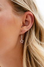 Load image into Gallery viewer, A strand of gleaming silver popcorn chain leads the eye down to a collection of silver horseshoe-like strands that coalesce below the collar. Attached to the horseshoe fittings, an oversized yellow star, turquoise diamond, and red lip charm add a youthful pop of color to the design for a trendy finish. Features an adjustable clasp closure.
