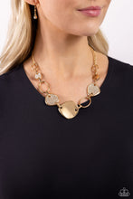 Load image into Gallery viewer, A shiny series of asymmetrical, concaved gold discs, some embossed in white rhinestones, alternate with airy gold frames as they delicately increase in size and link below the collar, creating an artisanal-inspired statement. Features an adjustable clasp closure. 
