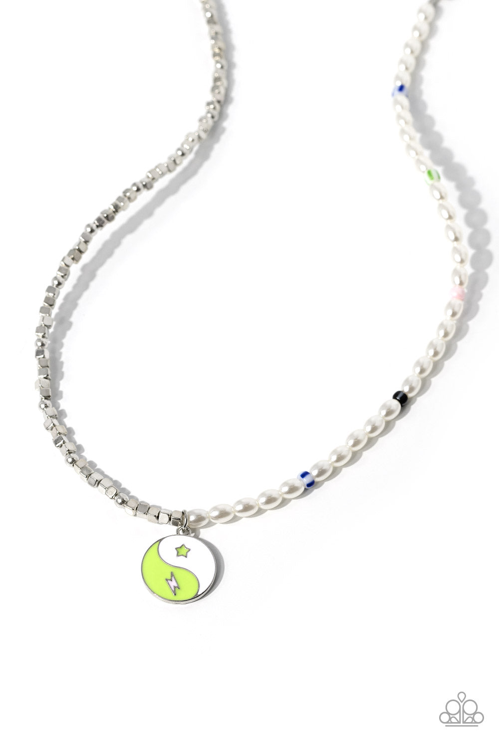 A strand of oval white pearls, sporadically infused with multicolored-striped beads, collides with cubed silver beads and studs to create an abstract blend of elegance and sheen. A yin-yang charm featuring white and Kohlrabi accents and star and lightning bolt symbols dangles from the bottom of the contrasting design for the perfect balance of color. Features an adjustable clasp closure. 