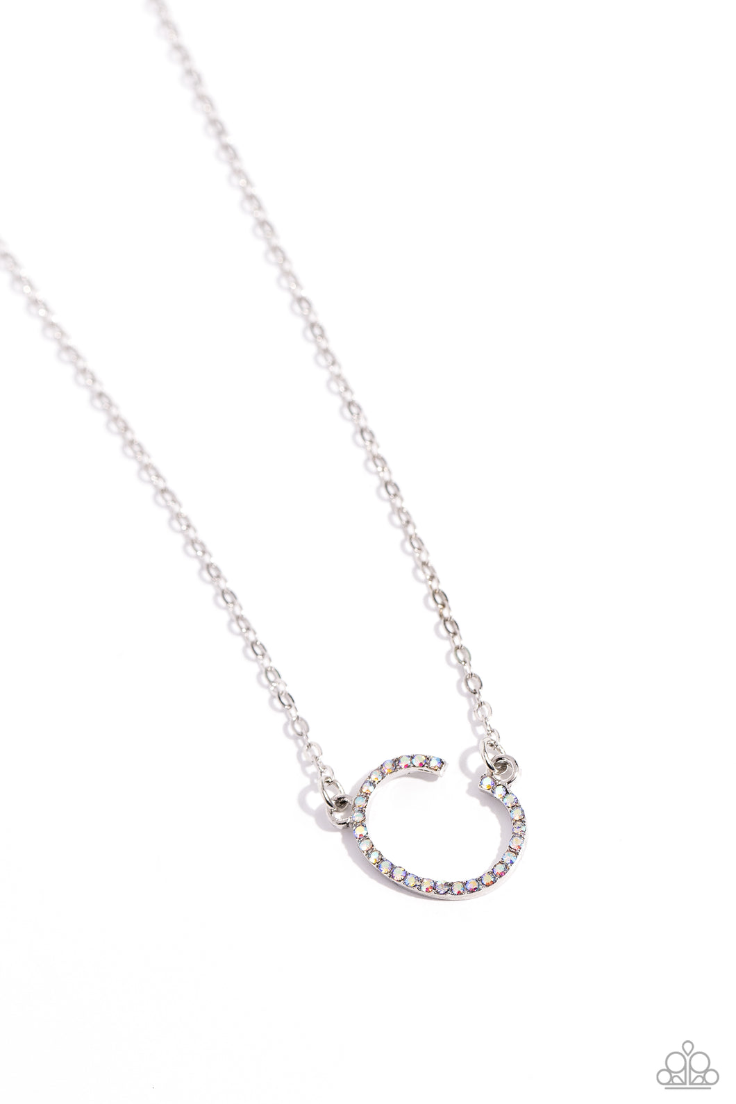 Embossed with dainty iridescent rhinestones, a silver letter 