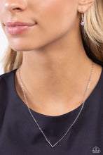 Load image into Gallery viewer, Embossed with dainty iridescent rhinestones, a silver letter &quot;L&quot; hovers below the collar from a dainty silver chain, for a sentimentally simple design. Features an adjustable clasp closure. Due to its prismatic palette, color may vary. 
