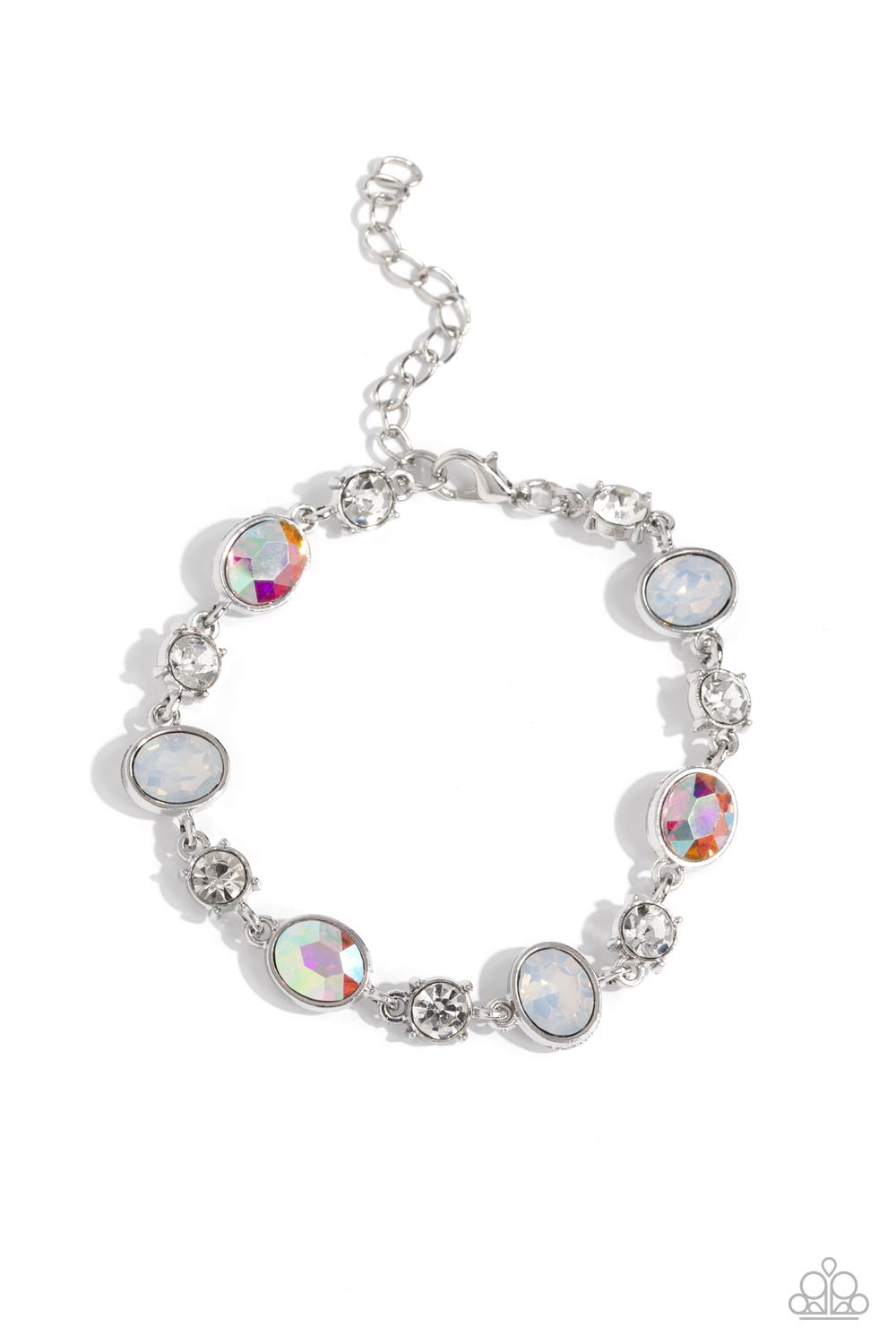 Featuring pronged silver fittings, white solitaire rhinestones alternate with oval opalescent and iridescent gems, linking around the wrist for a timeless, dreamy finish. Features an adjustable clasp closure. Due to its prismatic palette, color may vary. 