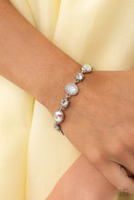 Load image into Gallery viewer, Featuring pronged silver fittings, white solitaire rhinestones alternate with oval opalescent and iridescent gems, linking around the wrist for a timeless, dreamy finish. Features an adjustable clasp closure. Due to its prismatic palette, color may vary. 
