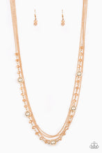 Load image into Gallery viewer, Infused with rows of shimmery gold chains, a strand of golden crystal-like beads and classic gold accents drape across the chest for a regal finish. Features an adjustable clasp closure.  Sold as one individual necklace. Includes one pair of matching earrings.
